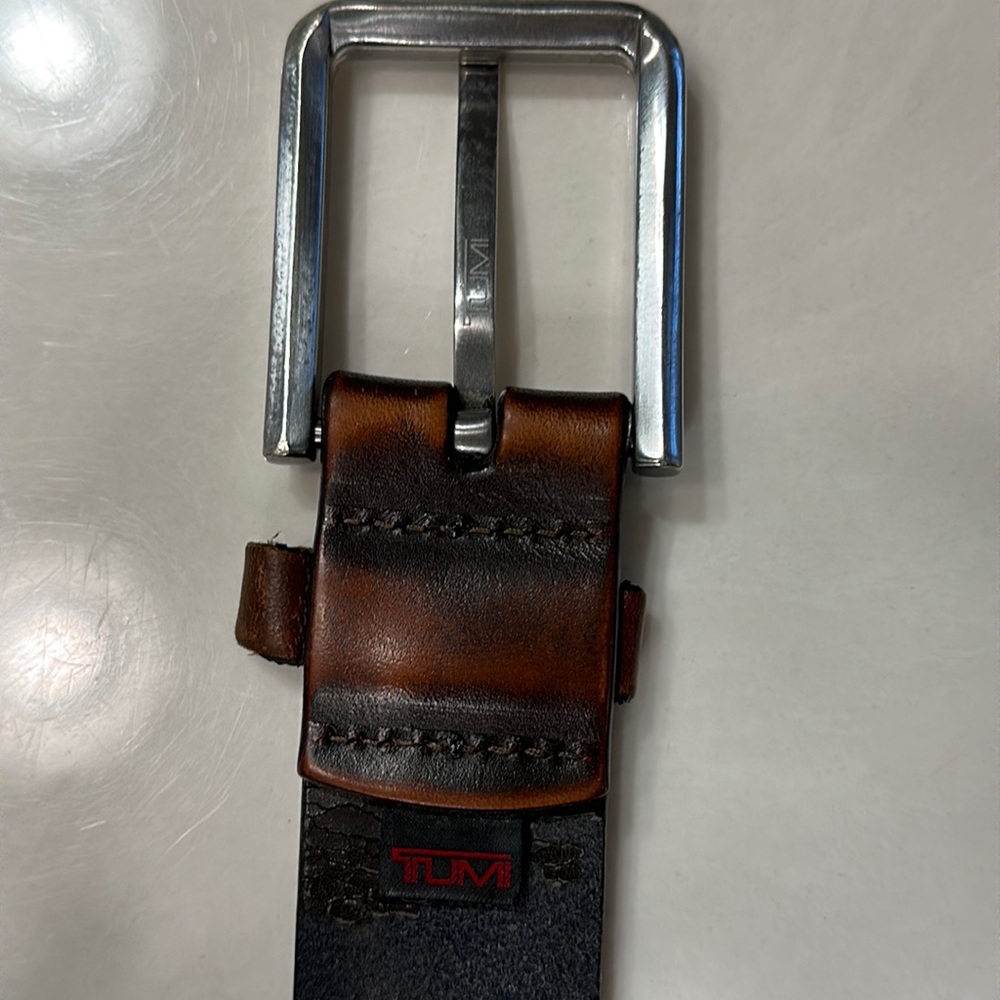 Tumi men’s leather belt size 34-36 very worn but is extremely durable leather